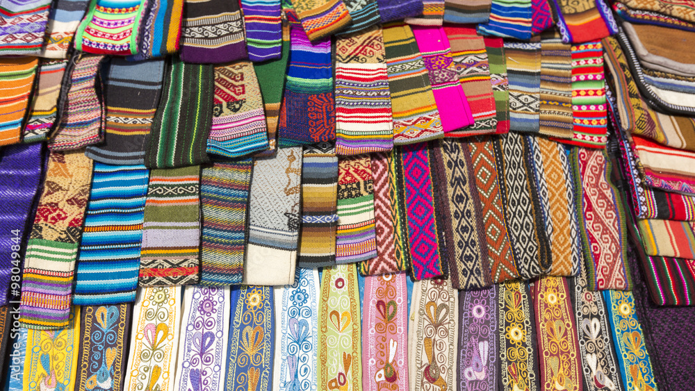 Woolen colored fabrics at the Andean market of Cusco, Peru