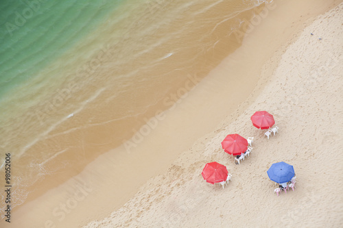 Looking down at umbrellas and cabanas on a beach