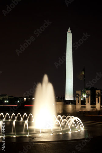 Washington Monument with the fountains at The World War II Memorial at night in Washington DC