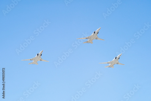 Tupolev Tu-22M3 (Backfire) supersonic swing-wing long-range strategic and maritime strike bombers fly against blue sky background