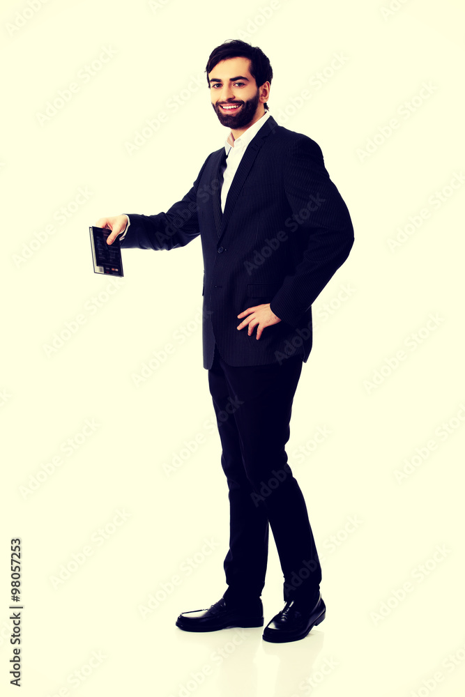 Young businessman holding copy space. Young businessman holding copy space.