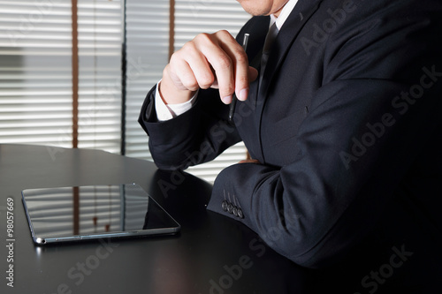Businessman working with Tablet device in the workplace