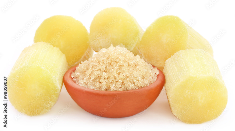 Piece of sugarcane with red sugar Piece of sugarcane with red sugar