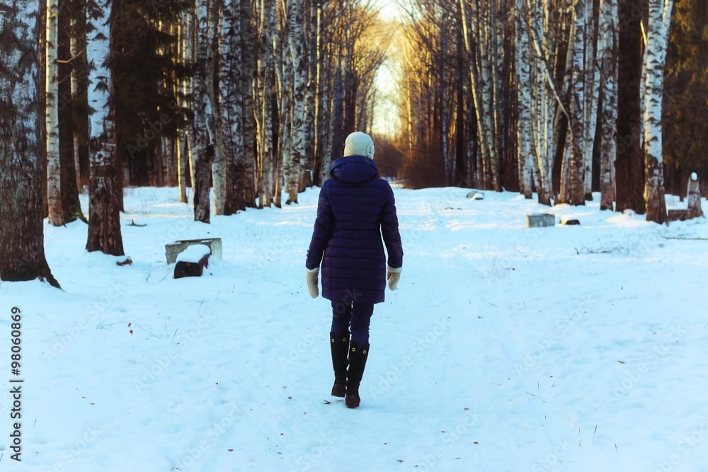 woman walk park winter snow back