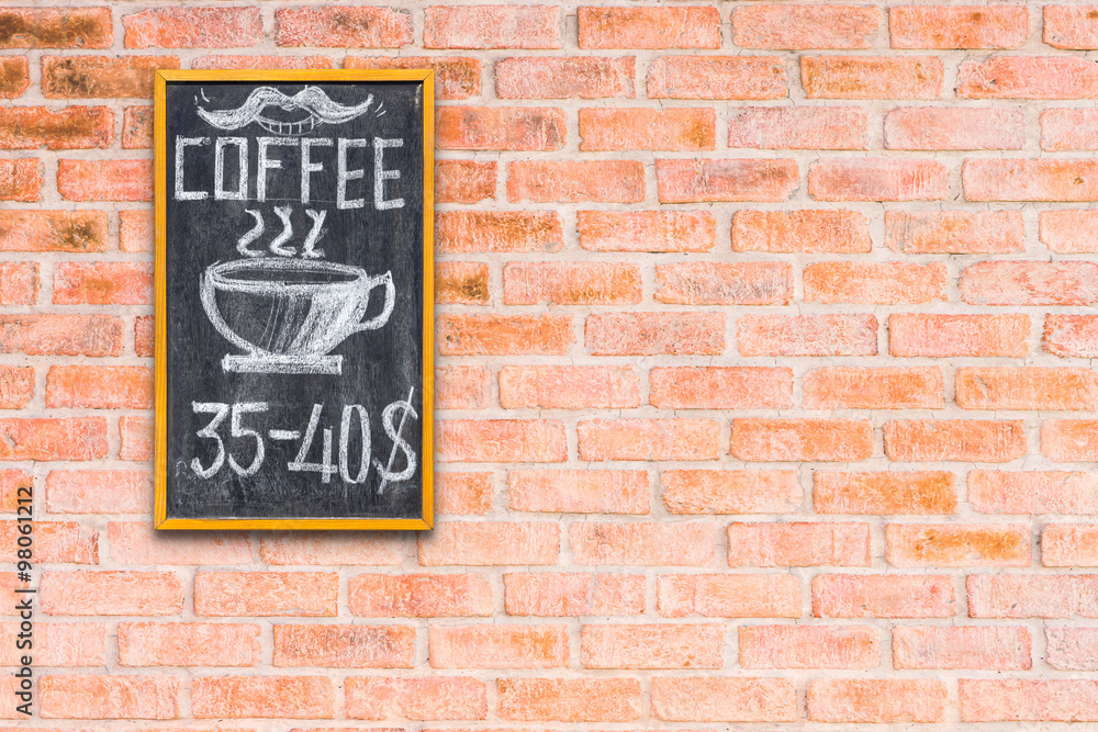 Empty chalk board on brick wall background Empty chalk board on brick wall background