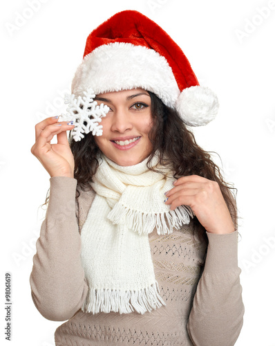 beautiful young woman portrait  in santa helper hat with big snowflake posing on white