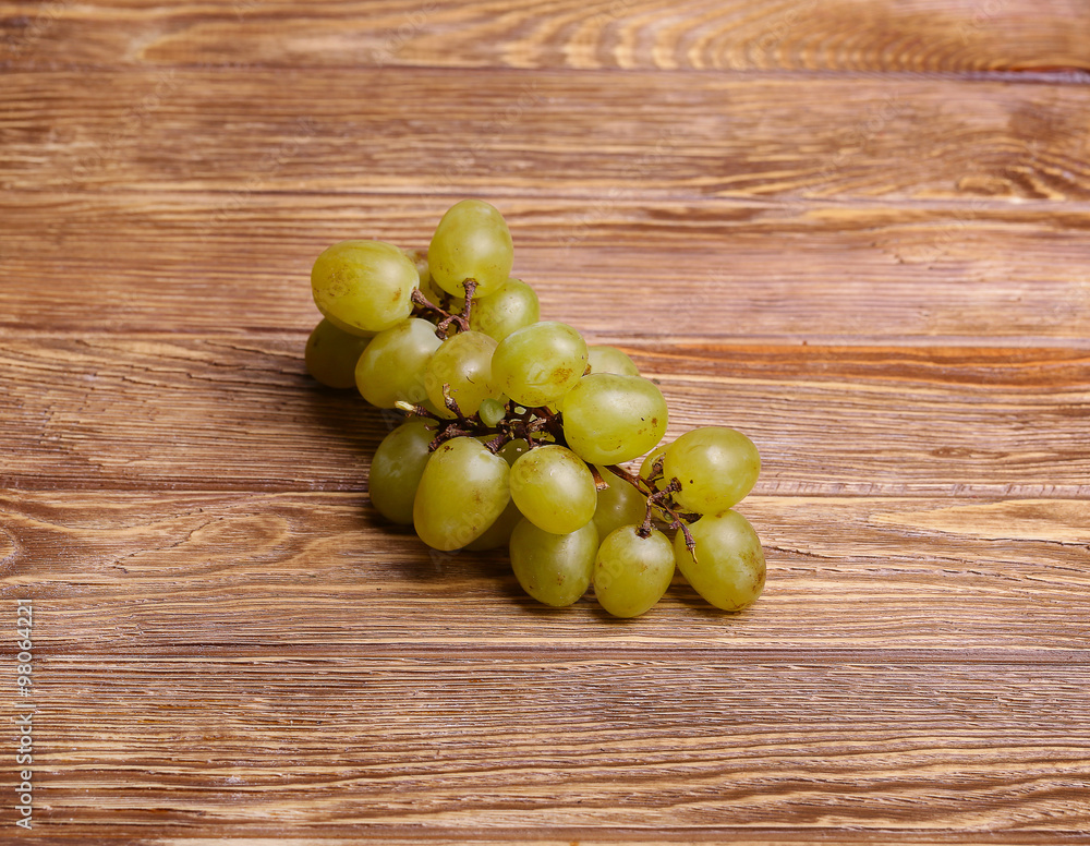 Grapes on a wooden table Grapes on a wooden table