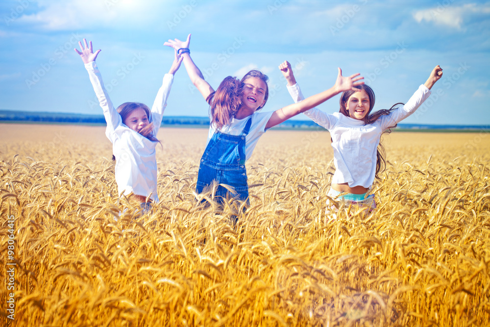 Jumping kids in the wheat field Jumping kids in the wheat field