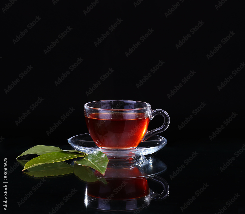 Glass cup of tea on black background. Glass cup of tea on black background.