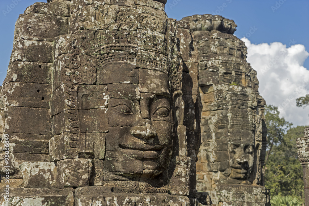 Buddha's stone faces with blue sky