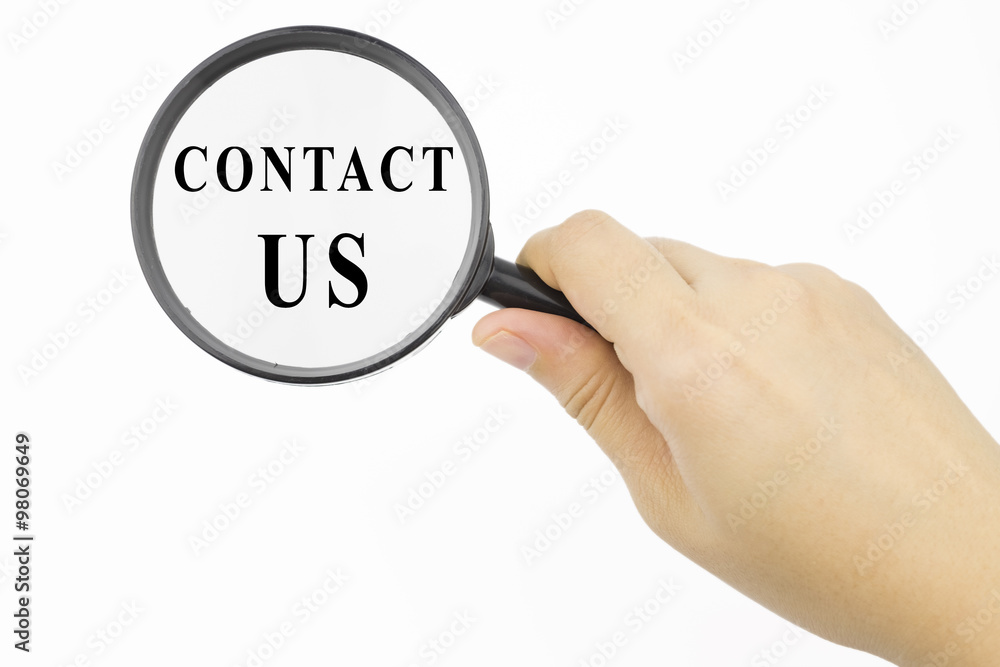 Magnifying glass with word CONTACT US in hand Magnifying glass with word CONTACT US in hand