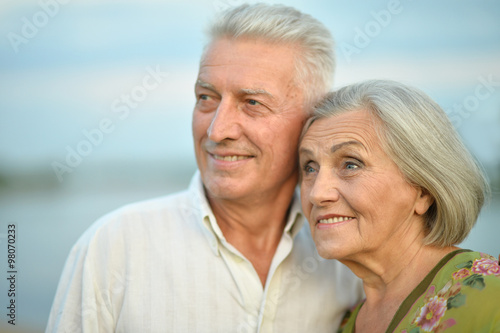 Elderly couple on nature at summer