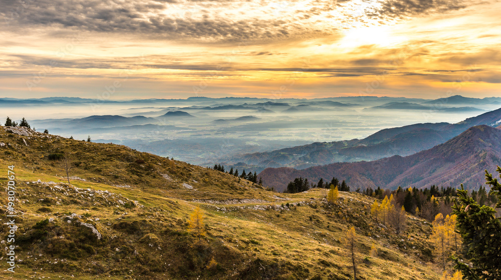 Fototapeta premium Sunset in the mountains. View of the valley