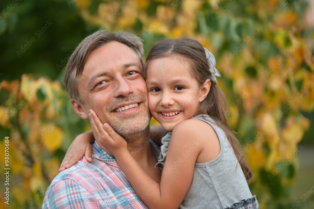 father with daughter in summer park father with daughter in summer park
