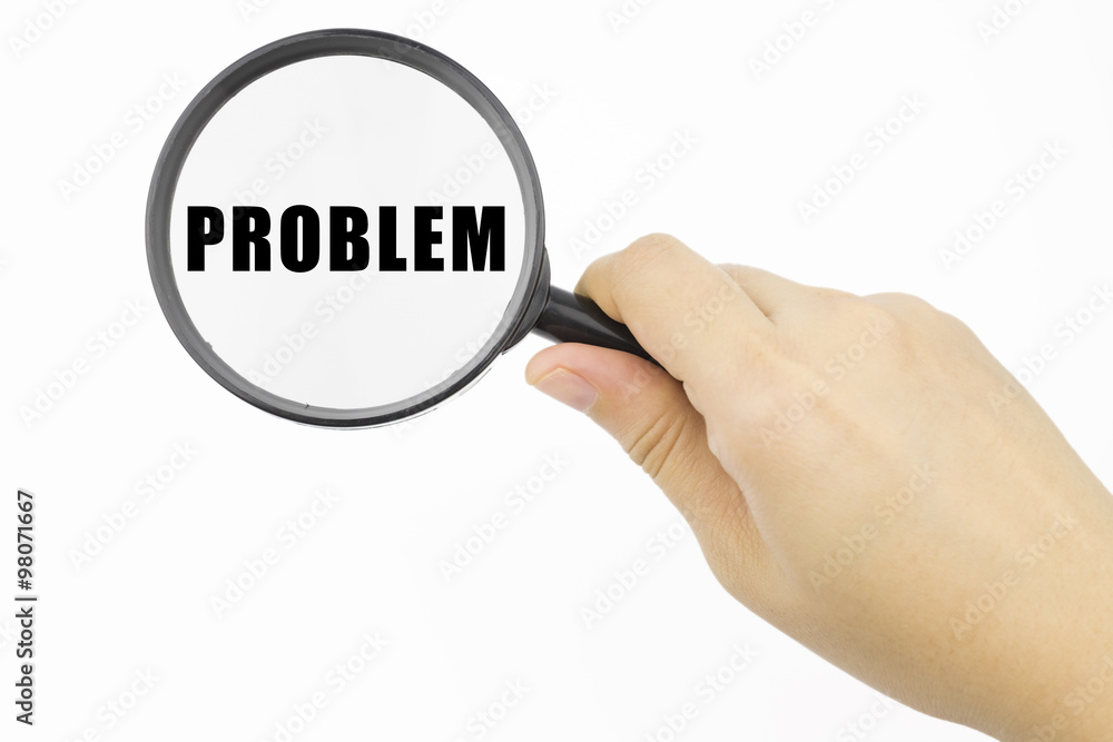 Hand showing PROBLEM word through magnifying glass Hand showing PROBLEM word through magnifying glass