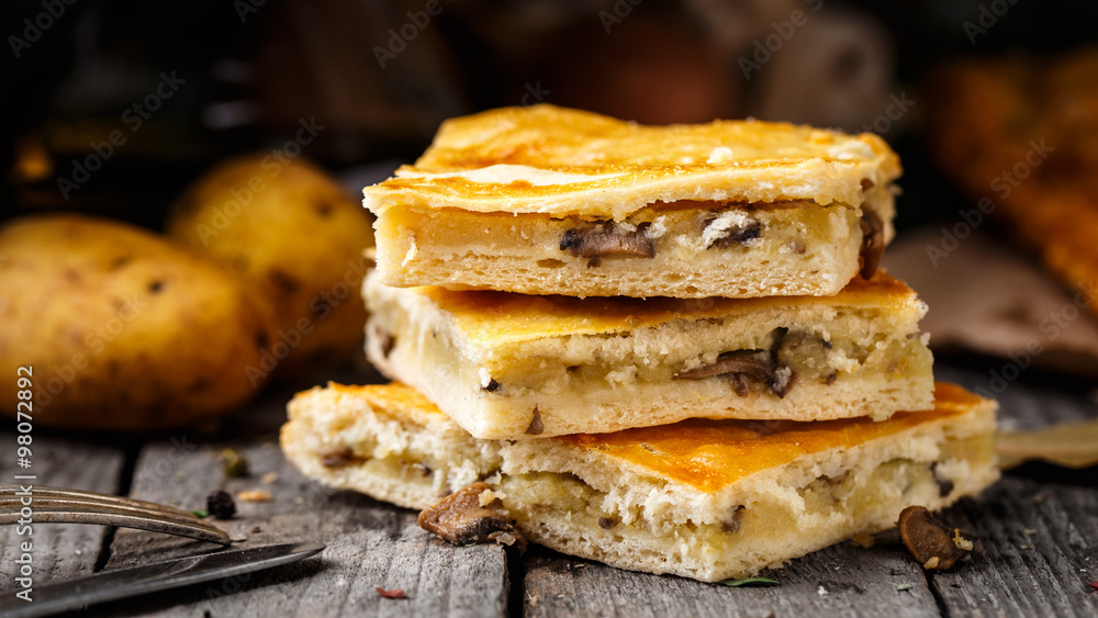Homemade pie stuffed with potato and mushrooms Homemade pie stuffed with potato and mushrooms
