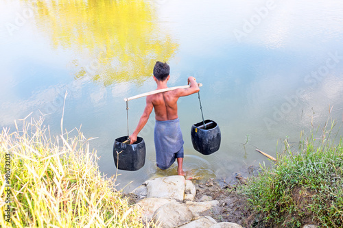 YANGON, MYANMAR - November 25, 2015: Water carrier with two buck