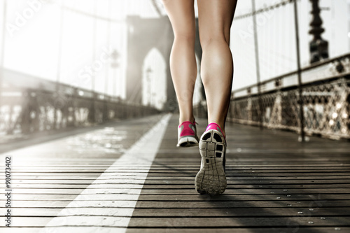 Female Runner on Brooklyn Bridge, NY photo
