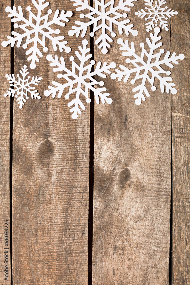 Decorative snowflakes on wooden background Decorative snowflakes on wooden background