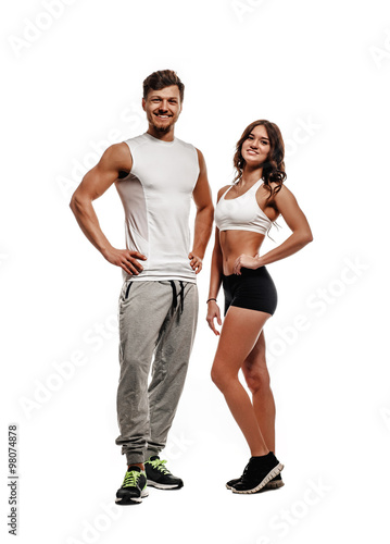Athletic couple isolated on white background