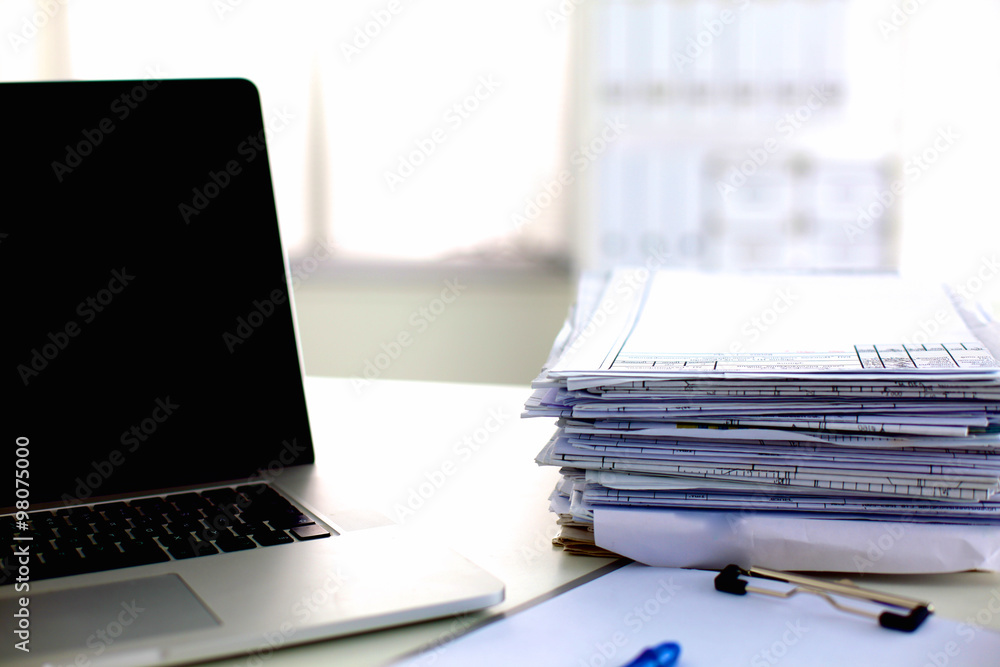 office desk a stack of computer paper reports work forms office desk a stack of computer paper reports work forms
