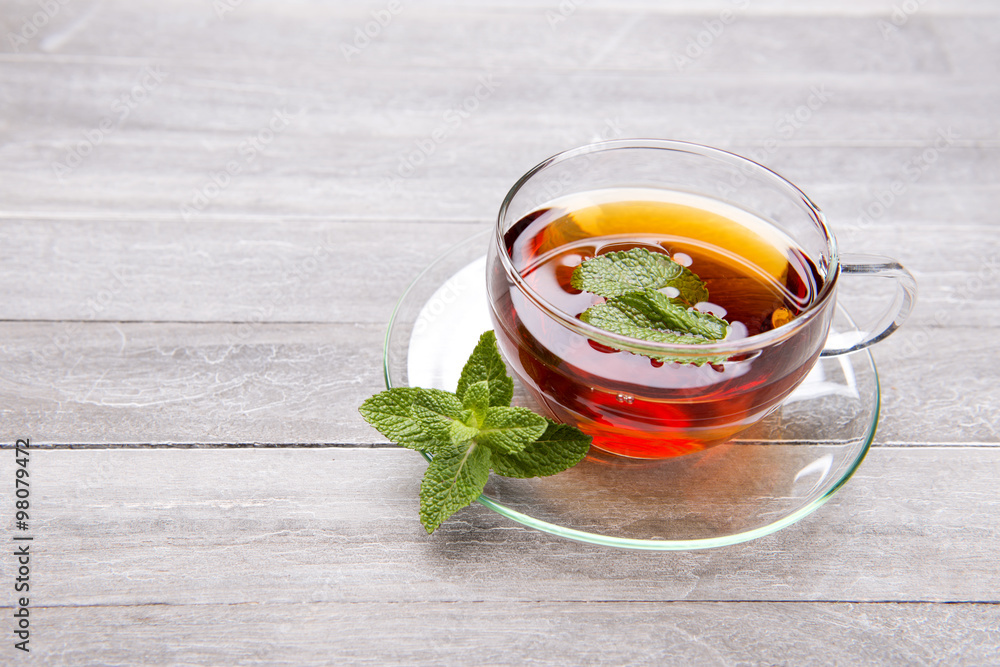reshly brewed tea in glass cup wooden background reshly brewed tea in glass cup wooden background