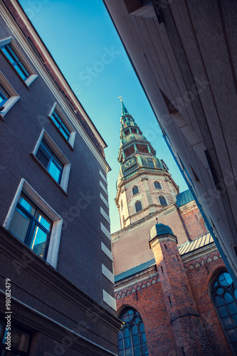 St Peters Church in old city Riga, Latvia. View from narrow street.