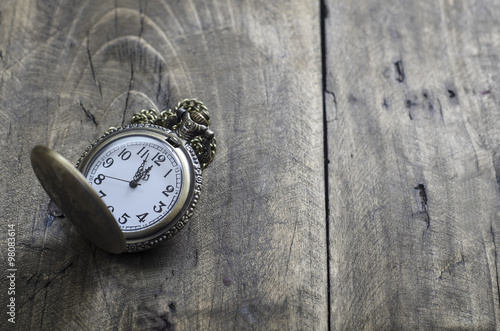 Wallpaper Mural Pocket watch and chain against aged wood Torontodigital.ca