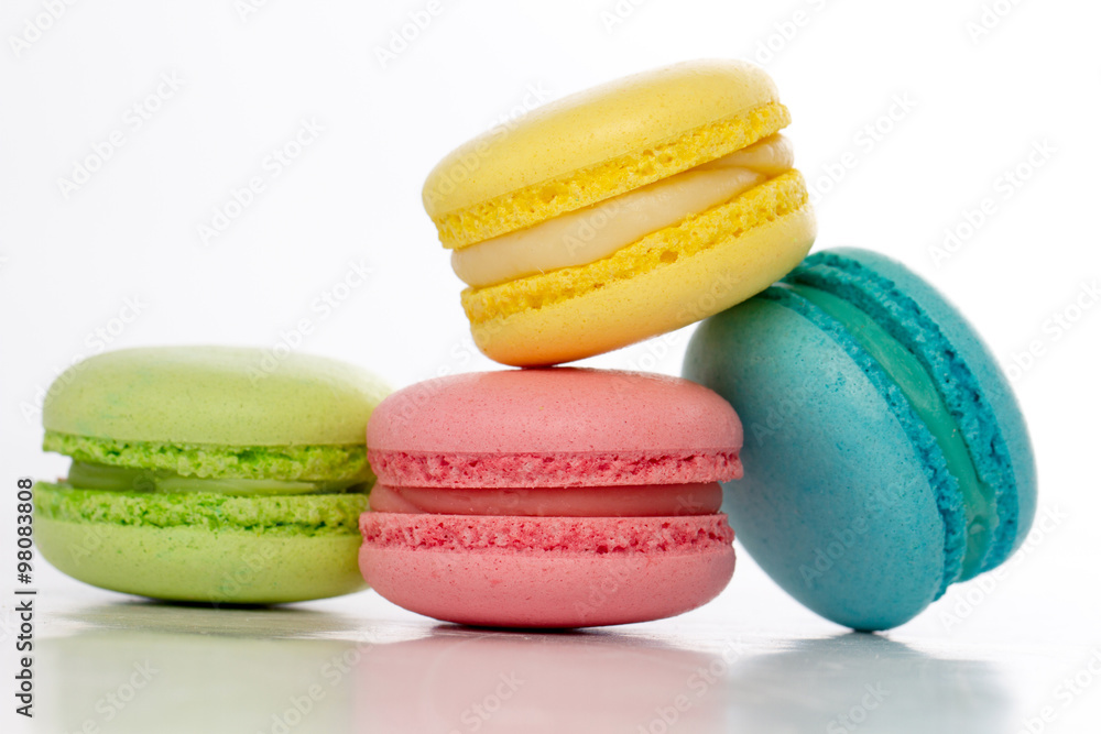 Collection of brightly colored French macarons on white backgrou Collection of brightly colored French macarons on white backgrou