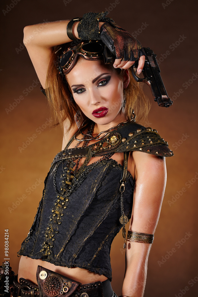 Steampunk woman over gunge background. . Fantasy fashion for cov Steampunk woman over gunge background. . Fantasy fashion for cov