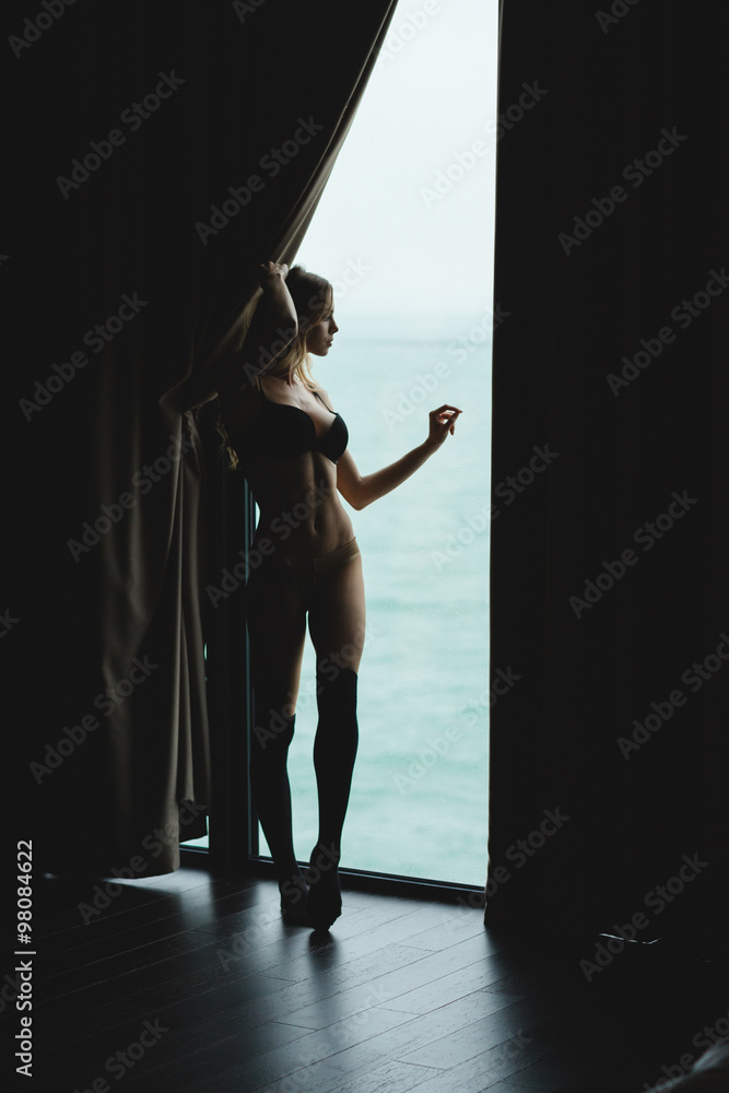 Alluring sensual young woman enjoying the view