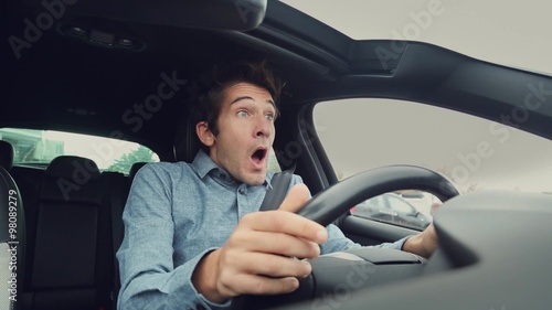 Scared man risking a car crash