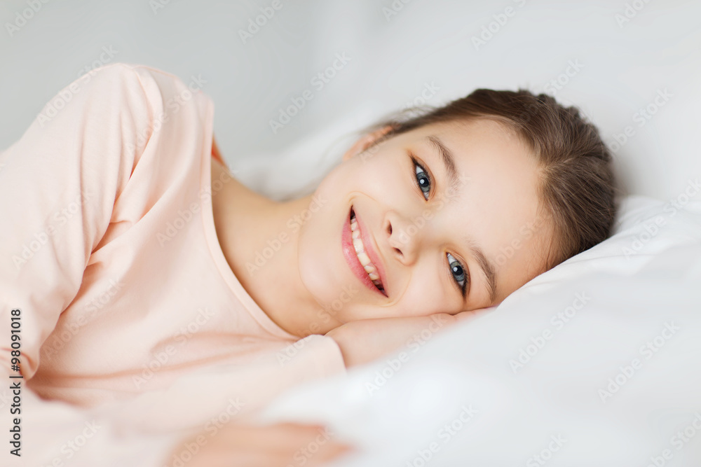 happy smiling girl lying awake in bed at home happy smiling girl lying awake in bed at home