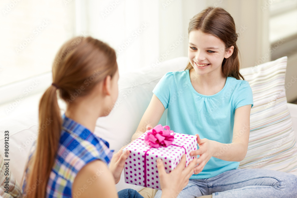 happy little girls with birthday present at home happy little girls with birthday present at home