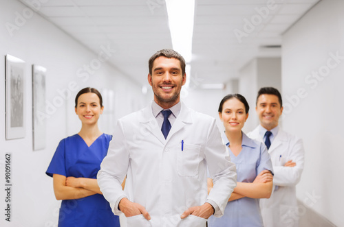 happy group of medics or doctors at hospital