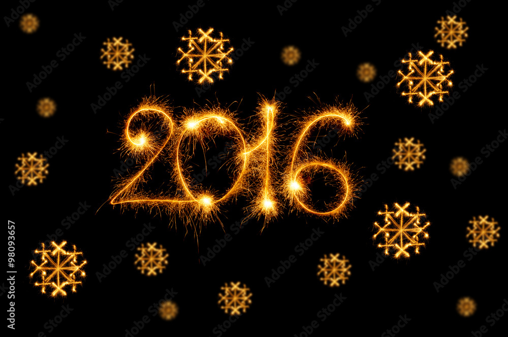 Happy New Year - 2016 with snowflakes made by sparklers on black Happy New Year - 2016 with snowflakes made by sparklers on black