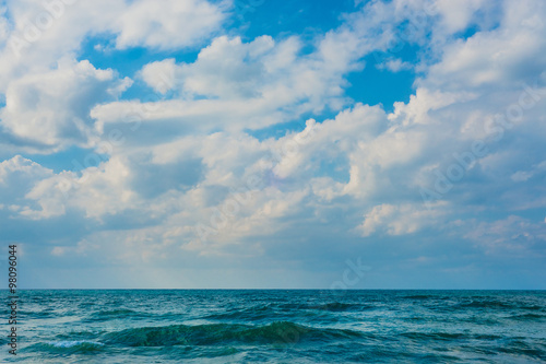 Sea background with cloudy sky.