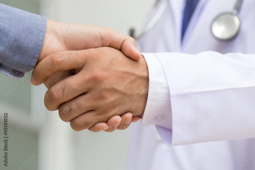 Doctor shakes hands with a patient Doctor shakes hands with a patient