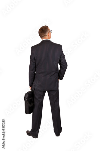 Back view of a walking business man with a notebook case and looking to a side, full length portrait isolated on white background
