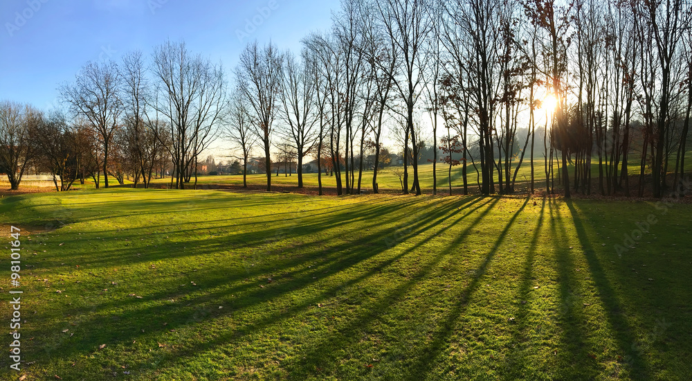 Golf course at sunset. Autumn season, sunny day.