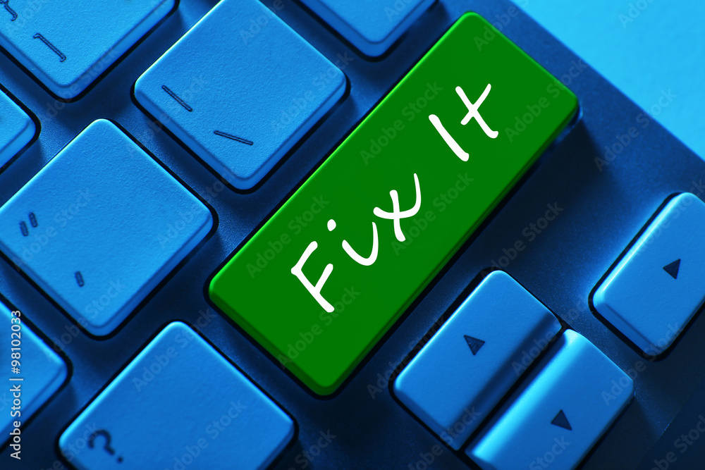 Close-up of laptop keyboard with color button and Fix it text Close-up of laptop keyboard with color button and Fix it text