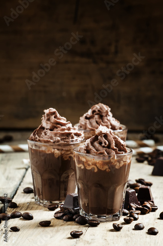 Chocolate-Coffee dessert with whipped cream, selective focus