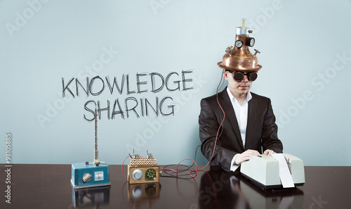 Knowledge is sharing concept with vintage businessman and calculator photo