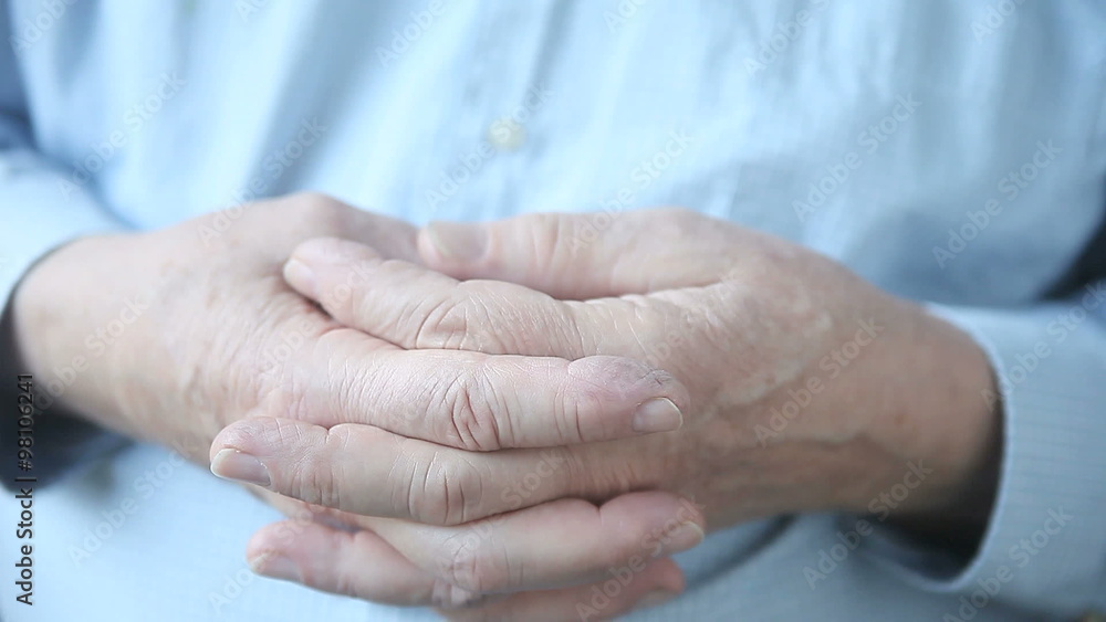 A man makes a universal gesture indicating boredom, impatience or forced idleness. A man makes a universal gesture indicating boredom, impatience or forced idleness.
