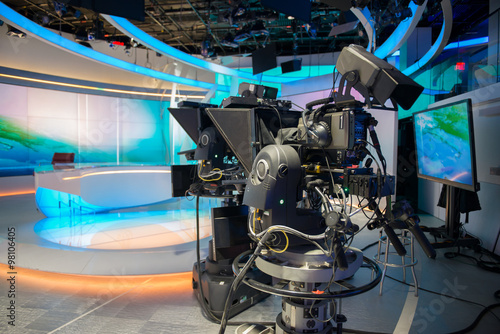 TV NEWS cast studio with camera and lights. photo