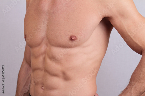 Close up of muscular male torso and chest hair removal. Male Waxing