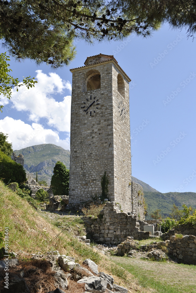 Clock tower in the Old Bar town on a sunny day, Montenegro.