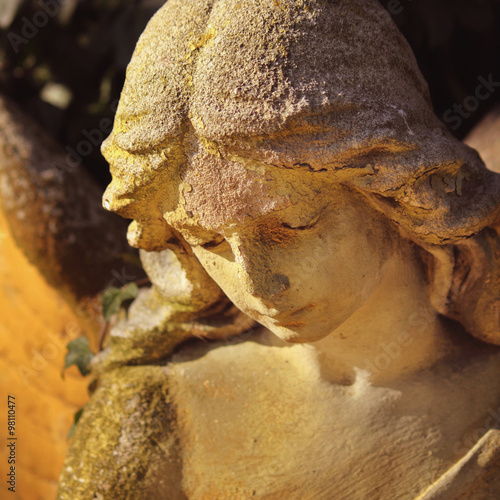 Beautiful close up af a face angel marble sculpture with a sweet