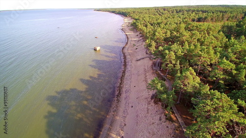 View from the sky of the Kaberneeme beach. Seen the trees in the forest and the sea  photo