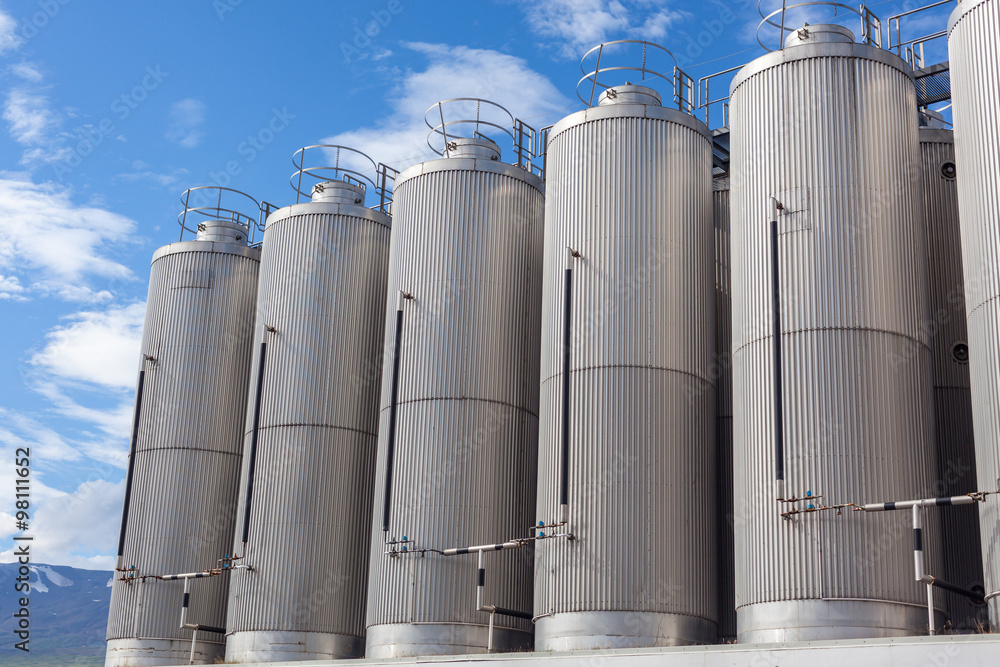 Giant industrial tanks on the bright blue sky Giant industrial tanks on the bright blue sky